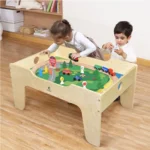 Two children building at the activity play table