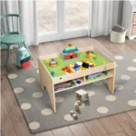 Activity table with building baseplate in a playroom on a dotted rug