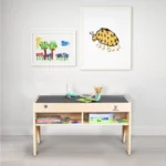 Reversible top activity table in a living room with two side storage bins