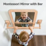 Child pulling themselves up on the Montessori mirror handrail