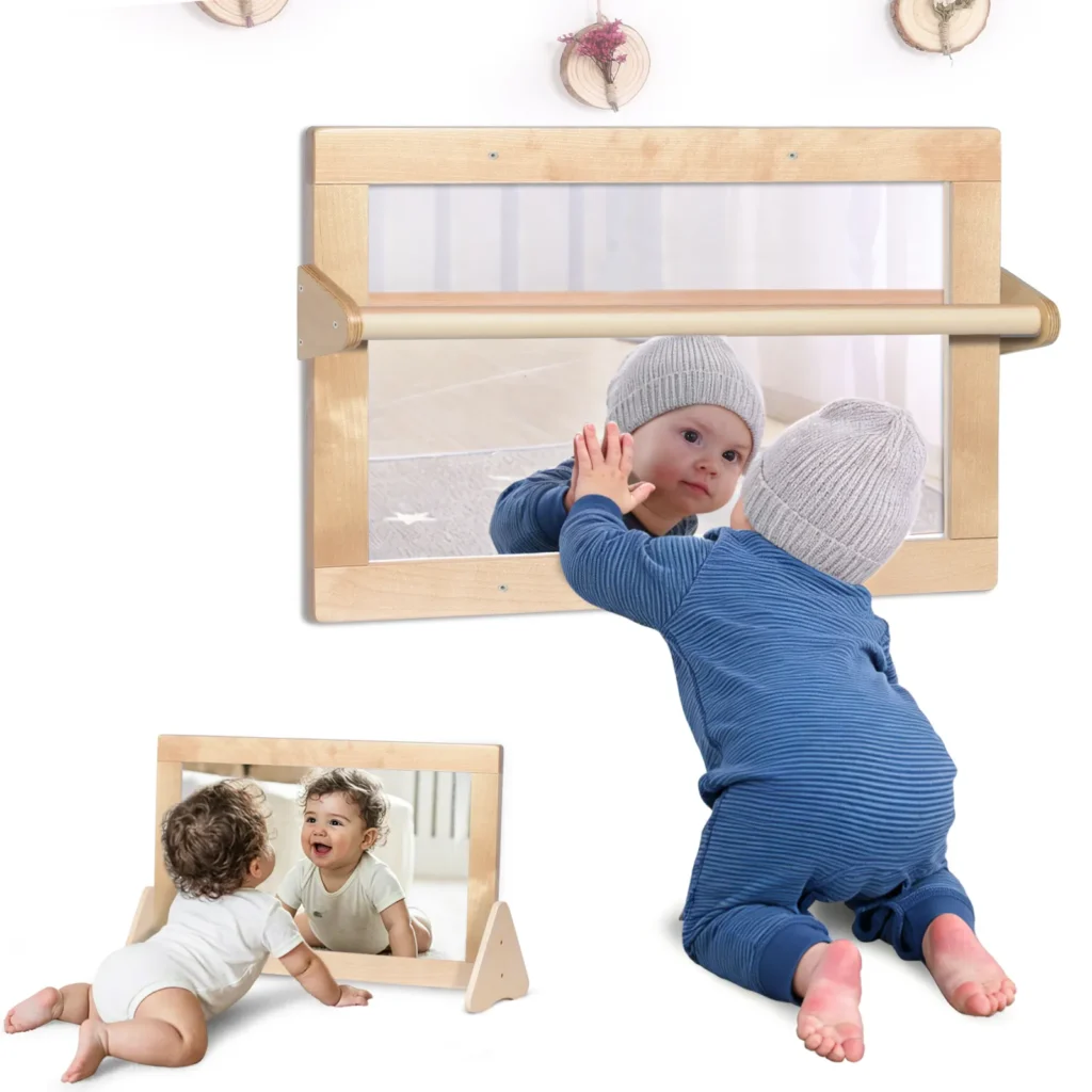 Montessori safety mirror set up on floor stands and on the wall with pull-up bars