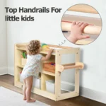 Toddler pulling up on the top grab handrails of the storage cabinet