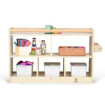 Closed back storage cabinet with five open cubbies filled with toys and books