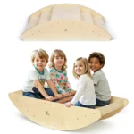 Four children sitting in the wooden rocking boat with the climbing bridge shown upside down