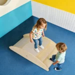 Child climbing the 5-step wooden bridge in a playroom