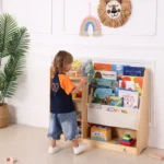 Child reaching for a book on the front-facing sling rack