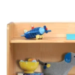 Close-up of the open shelves holding toys and books
