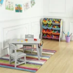 Grey kids table and chairs set in a bright playroom