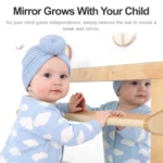Baby pulling up to standing on the Montessori mirror handrail
